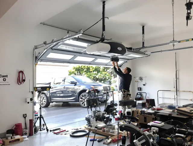 Lakewood Garage Door Repair specialist installing smart garage door opener system in Lakewood home
